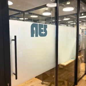 Image on an AES office with frosted glass and the AES logo on the door.